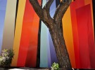 Next to the coloful fence